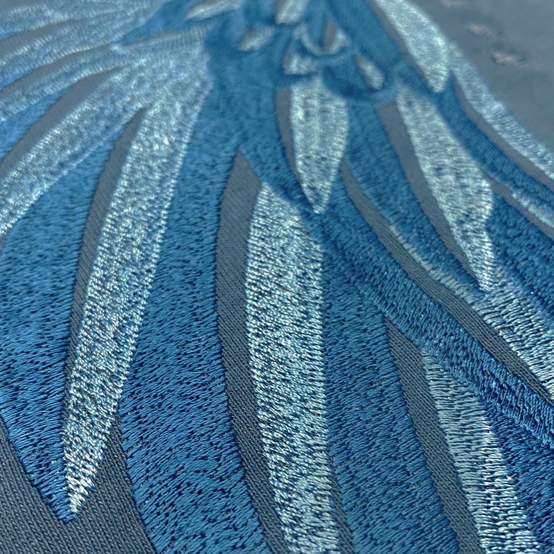The details of Zoelle Teal Embroidered Tee