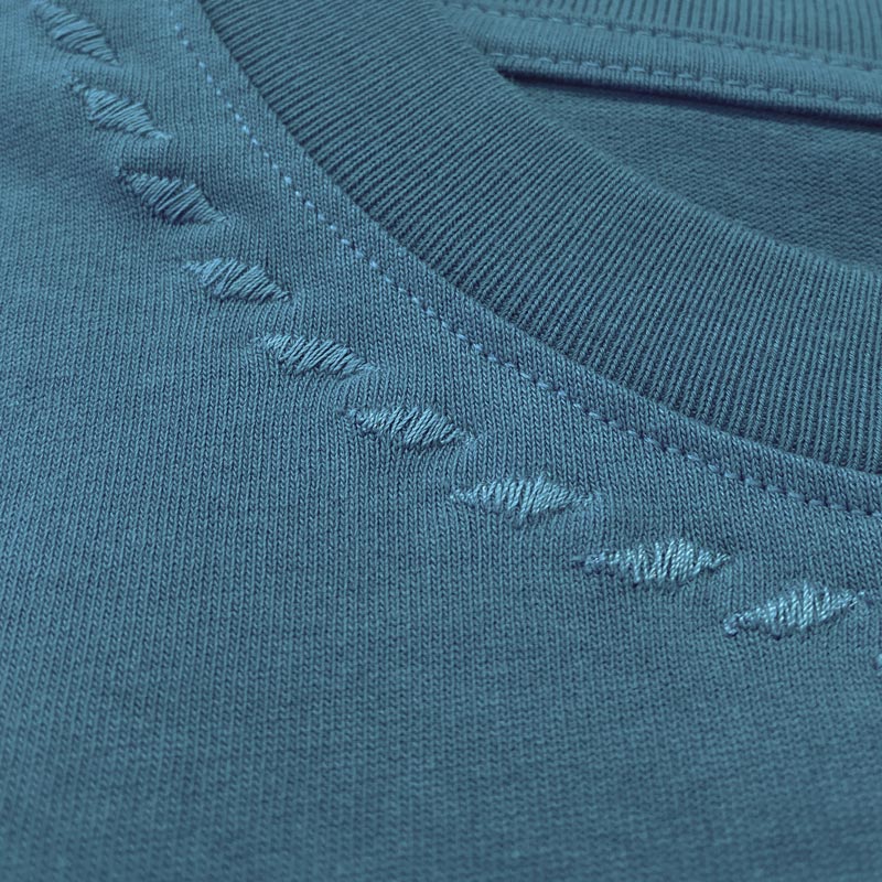 The details of Zoelle Teal Embroidered Tee